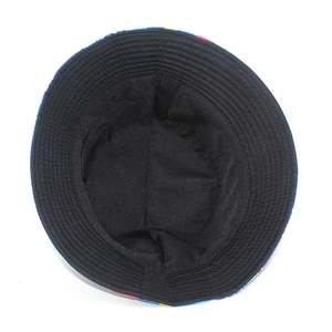 Detail of internal black lining and reinforced stitching on the colorful bucket hat