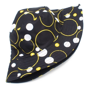 Outdoor sun protection bucket hat with yellow chain ring and polka dot print on black fabric