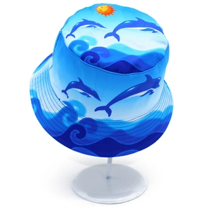 Blue ocean theme bucket hat featuring jumping dolphins and wave prints for outdoor travel