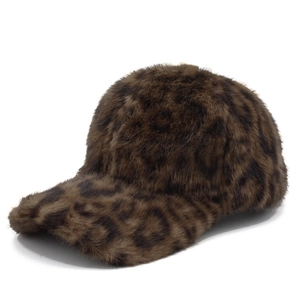 Detailed view of plush faux fur texture on a brown leopard print baseball cap