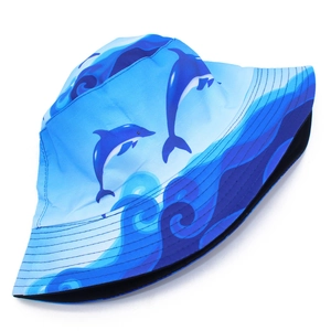 Detail of blue dolphin and ocean wave pattern on a reversible summer fisherman hat
