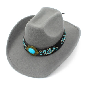 Macro shot of gray felt cowboy hat with embroidered band and turquoise gemstone