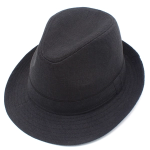 Detailed view of black fedora hat with fine woven texture and matching band decoration