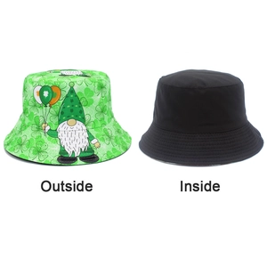 Detail of reversible St. Patrick's Day bucket hat with green shamrock pattern and black side