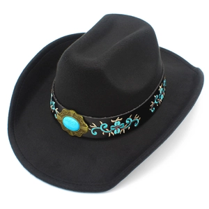 Detail of western cowboy hat with ethnic embroidery and turquoise stone on black wool felt
