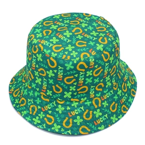 Close-up of Saint Patrick's Day bucket hat with lucky clover and horseshoe print