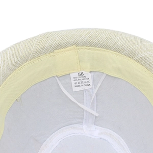 Detailed interior of a fedora hat showing size 58 label and sweatband with adjustable string