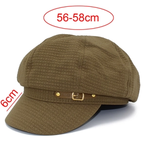 Detail view of khaki baker boy hat with waffle texture and buckle strap specs