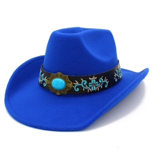 Detail of royal blue felt cowboy hat featuring ethnic embroidery and turquoise stone