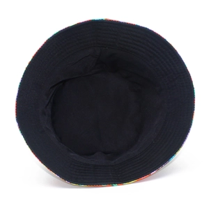 Detailed top view of a rainbow striped bucket hat showing the black fabric inner lining