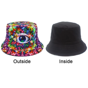 Double-sided bucket hat featuring a colorful psychedelic eye print and a plain black reverse