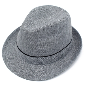 Close-up of the woven texture and black ribbon on a grey jazz fedora straw hat