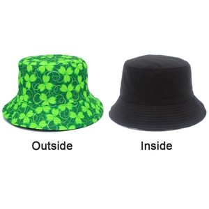 Detail showing dual-sided reversible St. Patrick's Day bucket hat with shamrock prints