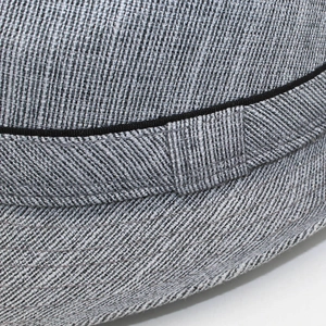 Close-up of the woven fabric texture and black ribbon detail on this stylish fedora hat