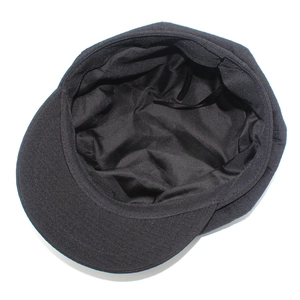 Detail of black newsboy hat featuring interior lining and adjustable drawstring cord