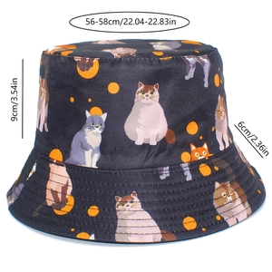 Detail of black bucket hat featuring cute cat prints and orange polka dot pattern