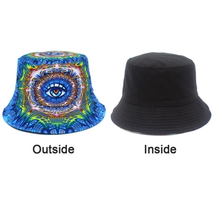Detailed view of reversible bucket hat showing psychedelic eye print and solid black side