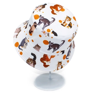 White bucket hat with colorful cute cat prints and orange polka dots for outdoor wear