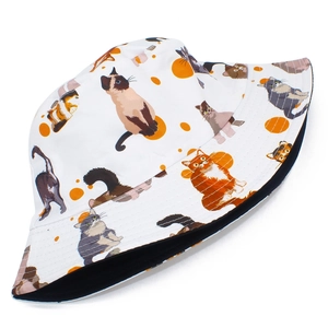 White bucket hat featuring cute multi-breed cat prints and orange polka dots for sun protection