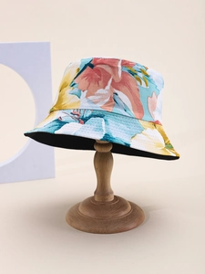 Detail showing colorful floral bucket hat with pink and yellow flowers and multi-row stitching