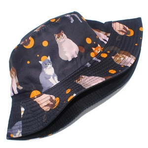 Black canvas bucket hat with cute colorful cat prints and orange polka dots for sun protection