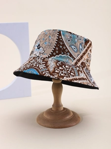 Detailed view of bohemian floral print sun hat with intricate paisley patterns