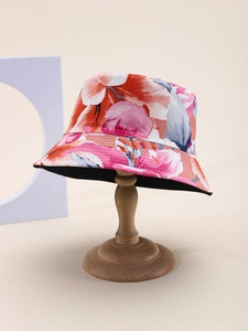 Detailed close-up of colorful floral pattern on summer sun hat with neat circular stitching
