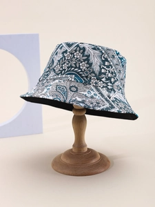 Detail view of the paisley and floral print pattern on a blue sun protection bucket hat