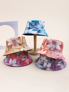 Detailed group view of five colorful floral cotton bucket hats with various flower patterns