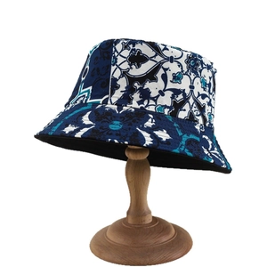 Fashionable bucket hat featuring vintage bohemian patterns and deep blue floral print