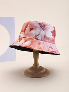 Close-up of vibrant floral bucket hat with multi-row stitching on brim and black lining
