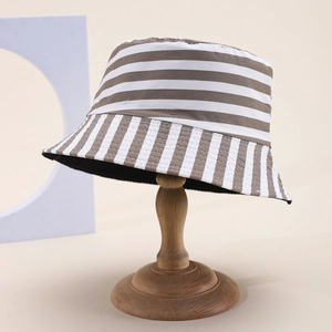 Unisex striped cotton bucket hat in brown and white on wooden stand for outdoor wear