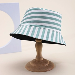 Green and white striped cotton bucket hat for men and women on wooden stand display