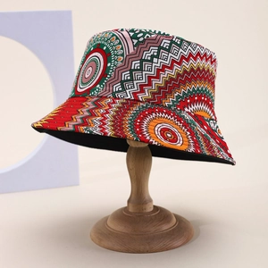 Detail of bohemian printed bucket hat with colorful geometric patterns on wooden stand