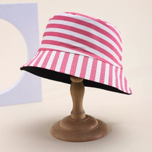 Close-up of pink and white striped bucket hat with stitching details on wooden stand