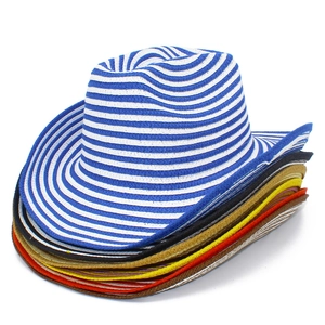 Close-up of colorful stacked straw cowboy hats with curved brims and woven texture