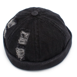 Detail of distressed black denim miki hat with retro ripped edges and vintage streetwear style