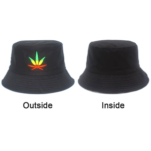 Detail of black reversible bucket hat showing colorful maple leaf embroidery on the outside