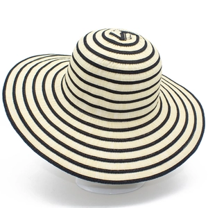 Chic beige straw sun hat with black stripes and wide brim for stylish UV protection