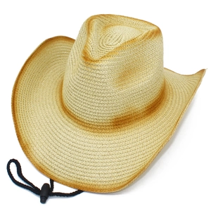 Dettaglio cappello cowboy in paglia intrecciata con tesa sfumata marrone e cinturino regolabile