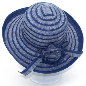 Women's wide brim striped sun hat in navy blue with decorative flower and ribbons