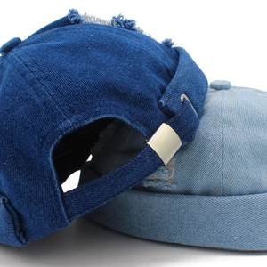 Retro distressed denim docker cap in dark and light blue with adjustable metal buckle