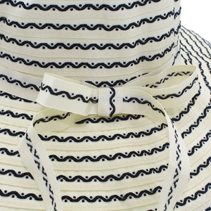 Women's foldable striped sun hat with elegant bow decoration and wide brim detail