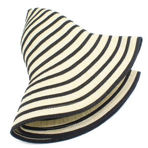 Detail of the foldable wide brim sun hat showing black and beige striped woven texture