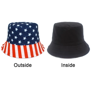 Reversible bucket hat featuring American flag stars and stripes with solid black interior side