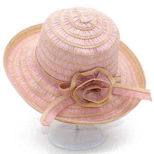 Women's summer sun hat with pink striped weave and fabric flower on a display stand