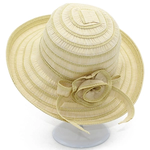 Close-up of elegant summer sun hat featuring detailed fabric flower and ribbon decoration