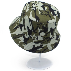 Detailed view of camouflage bucket hat featuring star print and reinforced brim stitching