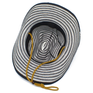 Internal view of striped straw fedora featuring black sweatband and adjustable wind rope