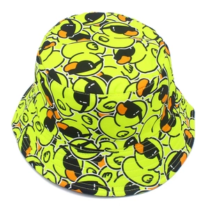 Neon yellow bucket hat with cartoon duck prints wearing sunglasses for outdoor style